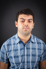 Handsome man doing different expressions in different sets of clothes: sad