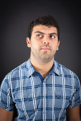 Handsome man doing different expressions in different sets of clothes: tihinking