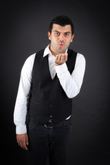 Handsome man doing different expressions in different sets of clothes: kiss