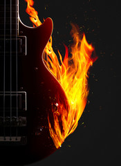 Naklejka premium Electronic bass guitar on fire.