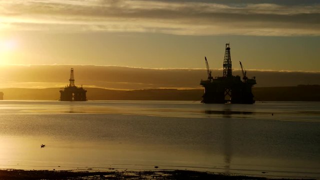 Silhouette of Semi Submersible Oil Rig and Big Boat at Cromarty Firth in Invergordon, Scotland
