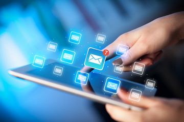 Fingers touching tablet with mail