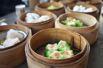 dim sum in bamboo steamer, chinese cuisine.