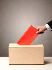 Ballot box with person casting vote