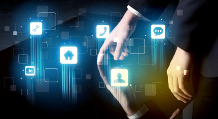 Modern smart table with high tech icons on its interface screen