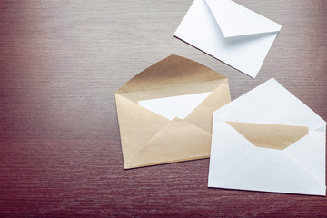 Photo of blank envelope on a  wooden background