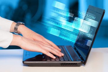 Obraz na płótnie Canvas Close up of man typing on laptop computer