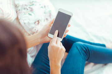 Woman with modern mobile phone in hands