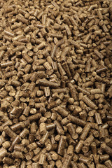 Wood pellets in the background.