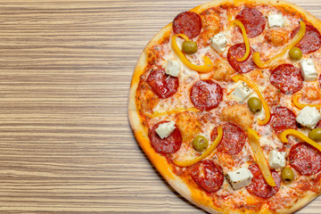 Delicious italian pizza served on wooden table
