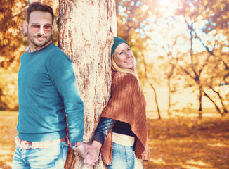 Romantic couple in autumn park. Love, dating, romance.