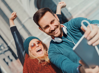 Beautiful young couple taking a selfie. Relationship and lifesty