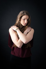 Fototapeta premium Beautiful woman doing different expressions in different sets of clothes: arms crossed