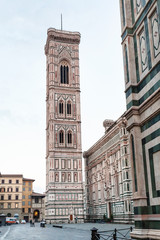 Fototapeta na wymiar Giotto's Campanile on piazza del Duomo in morning