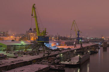 KYIV, UKRAINE-05 December 2016: Evening city landscape. River port and Pedestrian bridge