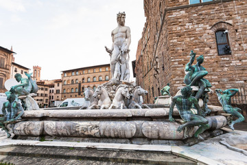 Fototapeta na wymiar Fountain of Neptune near Palazzo in morning