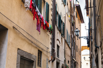 Fototapeta na wymiar apartment houses on street in center of Florence