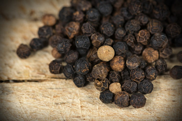 Peppercorns on Wooden Cutting Board