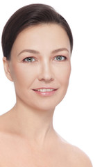 Obraz premium Portrait of beautiful healthy happy smiling mature woman over white background