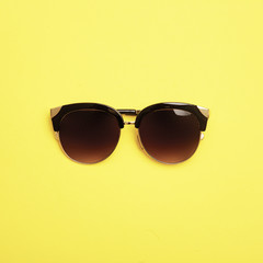 Flat lay. Top view. Fashion sunglasses on pastel background