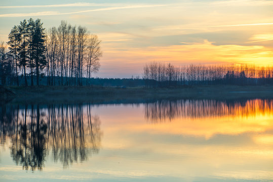 Sunset on the lake. Reflections in water. © Aleks Kend