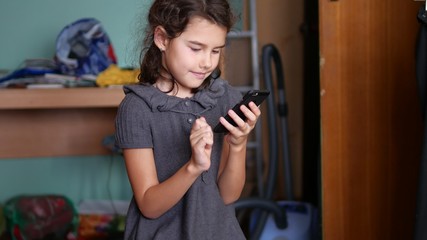 teen girl playing online school  games on your smartphone 