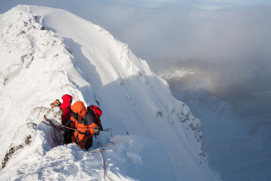 Mountaineering. Teamwork in alpinism.  Traverse of mountain.