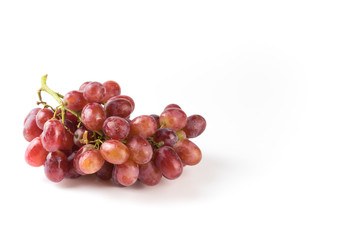Fresh purple grapes on a white background