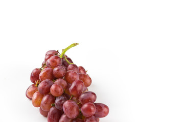 Fresh purple grapes on a white background