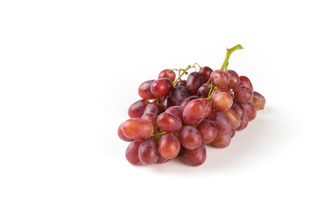 Fresh purple grapes on a white background
