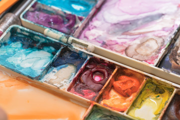 oil paints and paint brushes on a palette