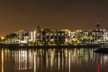 Obraz premium Amazing night lights Sultanate Oman Souly Bay harbour and Hotels Oceanside 7