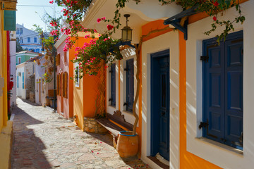 Fototapeta na wymiar Colorful architecture in a street of Halki village, Greece.