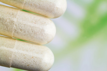 Glucosamine capsules, food supplement pills, top view, macro image.