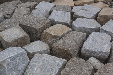 A pile of large gray paving stones
