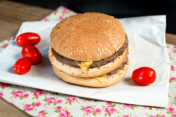 delicious American cheese burger with tomato
