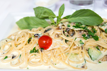 Spaghetti with aubergine and tomato on a the table