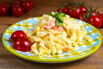 tasty pasta with salmon on a the table