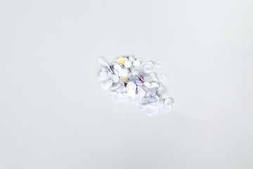 confetti from paper hold puncher on white background