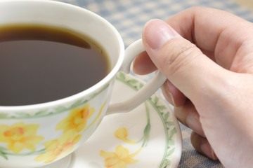 Woman holding a coffee cup