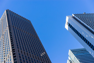 Fototapeta na wymiar Modern Office Buildings Against Blue Sky