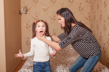 Mother trying to strangle her little daughter.
