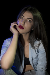 Fototapeta premium Young woman ,studio portrait on black background