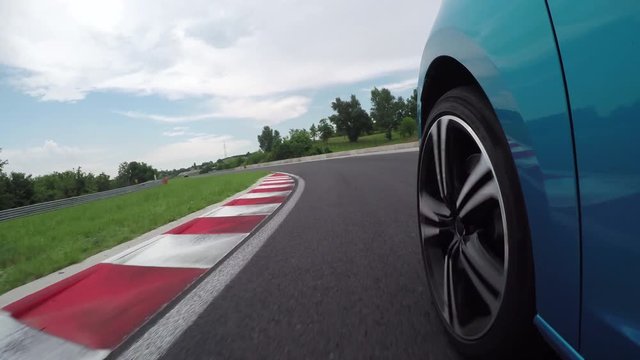 CLOSE UP: Sportscar racing on Hungaroring racetrack circuit, chasing other car