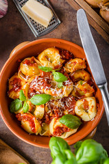 Homemade tortellini with tomato sauce