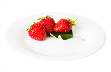 strawberries on a dish isolated white background
