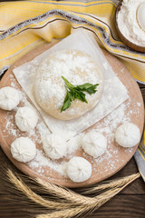 Raw khinkali in the kitchen. The process of preparing hinkaley. Closeup. Top view