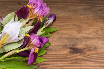 Wooden background with flowers. Top view