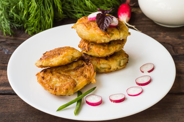 Potato pancakes for breakfast. Wooden rustic background