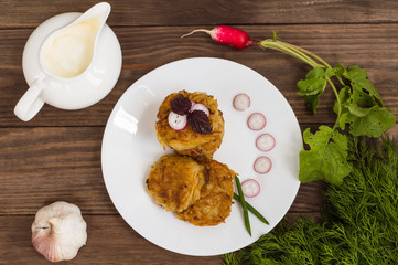 Potato pancakes for breakfast. Wooden rustic background